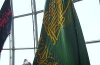 برافراشتن پرچم گنبد منور رضوی بر فراز برج میلاد تهران